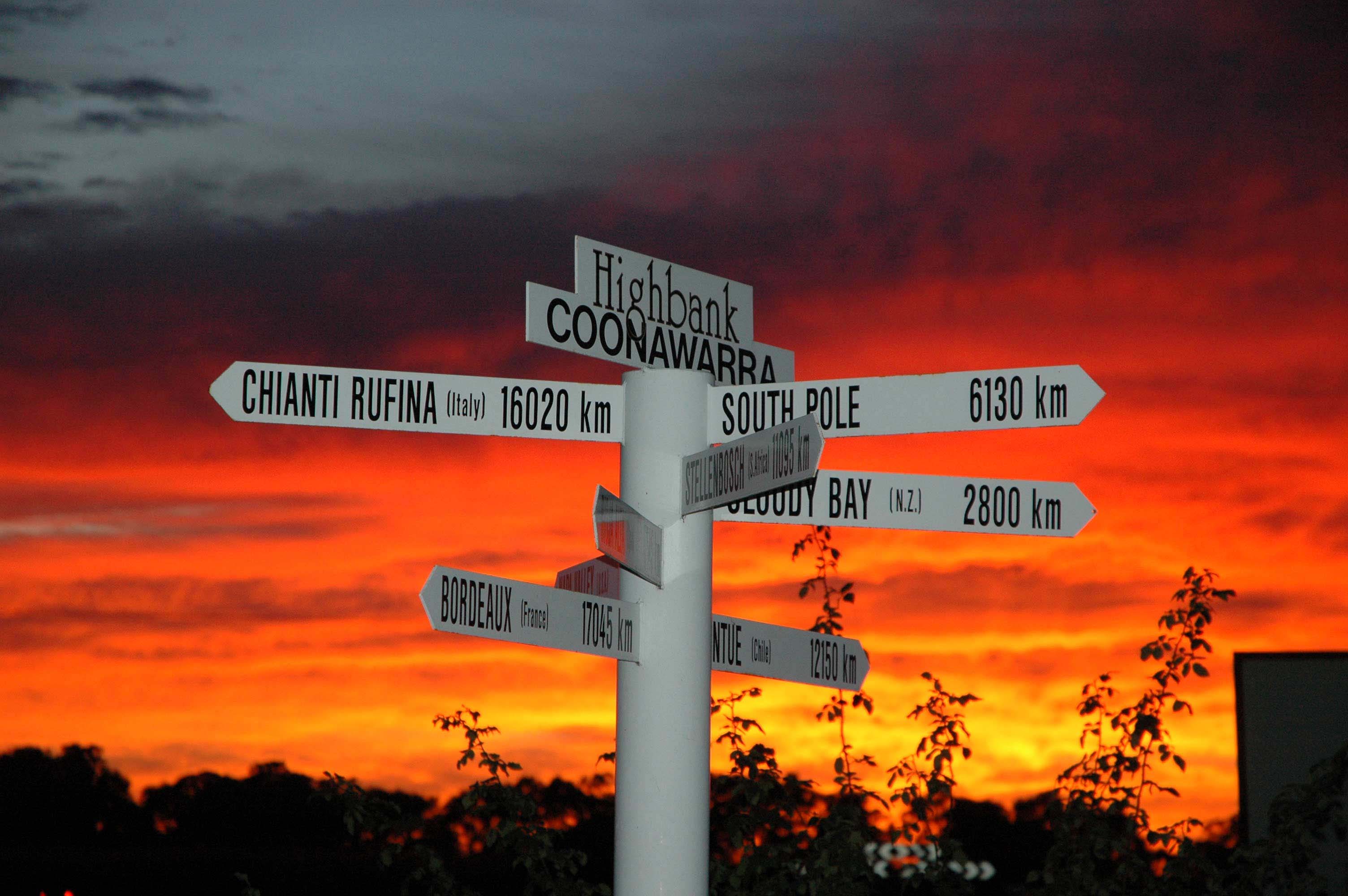Highbank signs at vineryard during sunset 